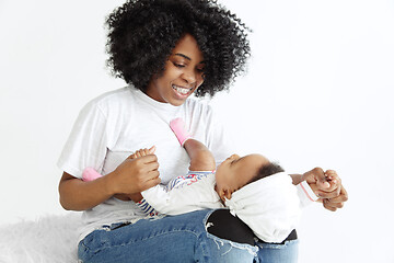 Image showing Portrait of beautiful african woman holding on hands her little baby