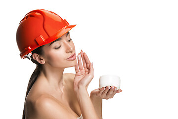 Image showing Portrait of confident female worker in orange helmet