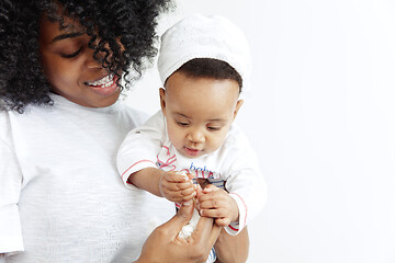 Image showing Portrait of beautiful african woman holding on hands her little baby