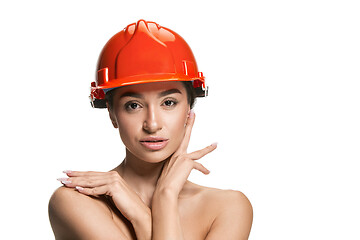 Image showing Portrait of confident female worker in orange helmet