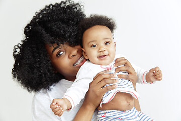 Image showing Portrait of beautiful african woman holding on hands her little baby