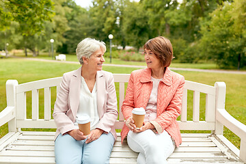 Image showing senior women or friends drinking coffee at park