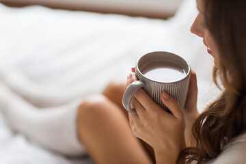 Image showing close up of happy woman with cup of coffee at home