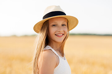 Image showing portrait of girl in straw hat on field in summer