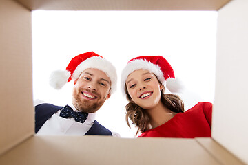 Image showing happy couple opening christmas gift box