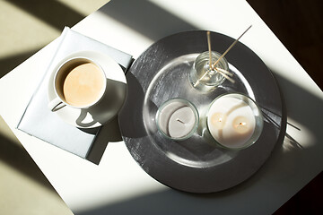 Image showing coffee, candles and aroma reed diffuser on table