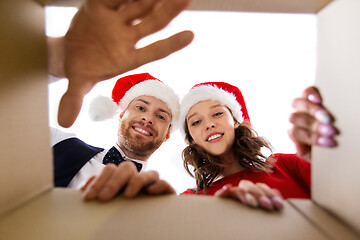 Image showing happy couple opening christmas gift box