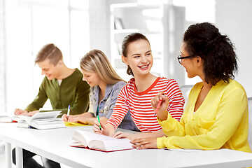 Image showing high school students with books and notebooks