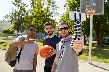 Image showing happy men taking selfie on basketball playground