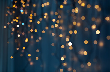 Image showing christmas garland lights over dark blue background