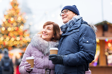 Image showing senior couple with coffee at christmas market