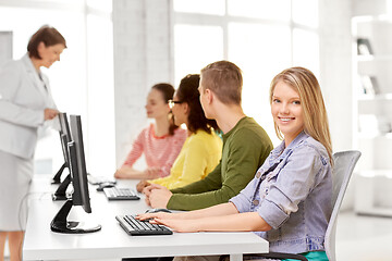 Image showing happy high school students in computer class