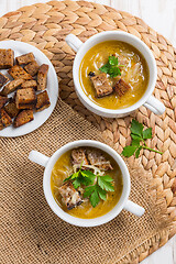 Image showing Traditional French onion soup with toasted bread croutons 