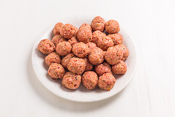 Image showing Raw meatballs on plate and white background