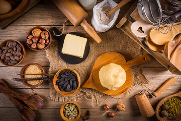 Image showing Assortment of baking ingredients and kitchen utensils in vintage wooden style