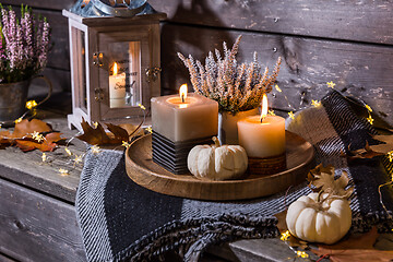 Image showing Autumn terrace or patio in night with pumpkins and heather plant 