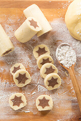 Image showing Baking christmas cookies with chocolate star. 