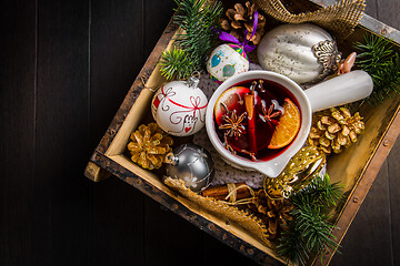 Image showing Mulled wine with orange, cinnamon and anise in mug for Christmas