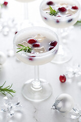 Image showing White Christmas margarita punch with cranberries and rosemary