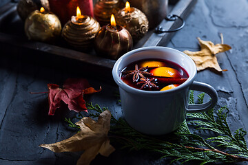 Image showing Mulled wine with orange, cinnamon and anise in mug