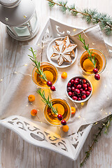 Image showing Christmas apple cider cocktail with cranberries and rosemary