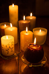 Image showing Candles on wooden background. Candlelights for Christmas.