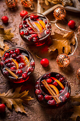 Image showing Mulled wine with orange, cranberries and cinnamon and anise 