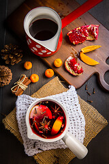 Image showing Hot spicy mulled wine with fruits and spices in mug