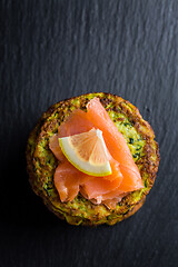 Image showing Homemade zucchini pancakes with smoked salmon and lemon