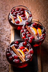 Image showing Mulled wine with orange, cranberries and cinnamon and anise 