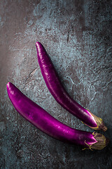 Image showing Japanese Eggplants, fresh aubergines on dark background