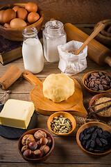 Image showing Assortment of baking ingredients and kitchen utensils in vintage wooden style