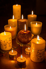 Image showing Candles on wooden background. Candlelights for Christmas.