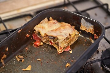 Image showing Lasagna leftover in a dirty kitchen