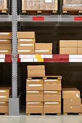 Image showing Warehouse stocked with boxes in stacks