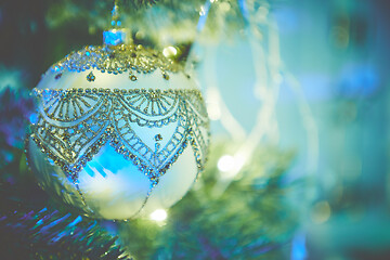 Image showing Colorful christmas ornaments and decorations hanging from christmas tree