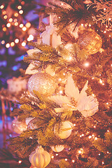 Image showing Colorful christmas ornaments and decorations hanging from christmas tree