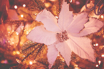 Image showing Colorful christmas ornaments and decorations hanging from christmas tree