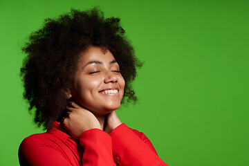 Image showing Closeup of pleased African-American girl smiling enjoying with closed eyes