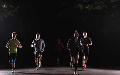 Image showing runners team on the night training