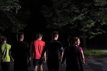 Image showing runners team on the night training