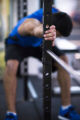 Image showing man doing pull ups on the vertical bar