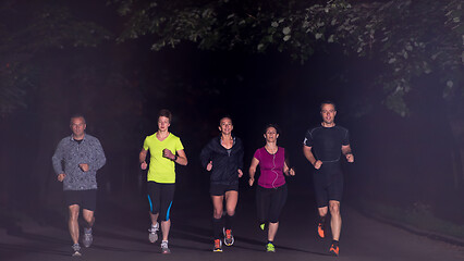 Image showing runners team on the night training