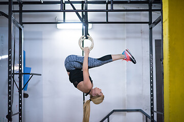 Image showing woman working out on gymnastic rings