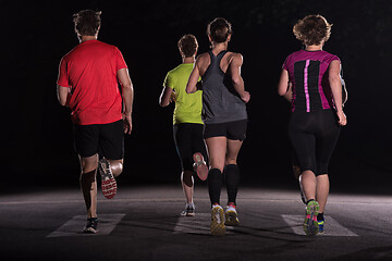 Image showing runners team on the night training