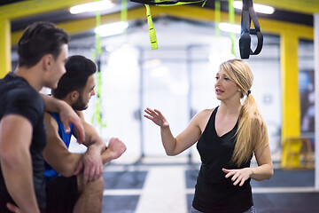 Image showing athletes working out  jumping on fit box