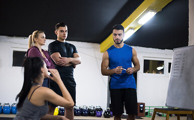 Image showing athletes getting instructions from trainer