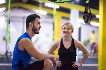 Image showing athletes working out  jumping on fit box