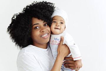 Image showing Portrait of beautiful african woman holding on hands her little baby