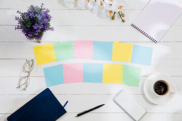 Image showing Message at colorful note papers on a desk background.